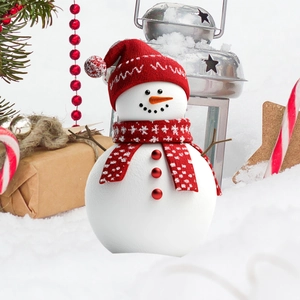 Christmas snowman garden stake with red scarf and hat on a snowy festive background