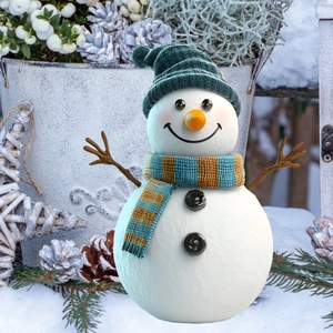 Winter snowman garden stake with blue knitted hat and striped scarf in a frosty scene
