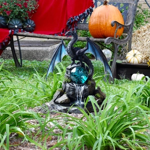 Detailed dragon statue with blue crystal ball for garden fountain and outdoor decoration