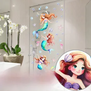 Detail of mermaid static window clings on glass showing double-sided colorful design