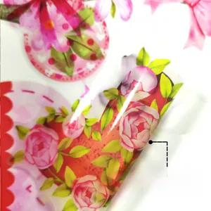 Macro shot showing peelable adhesive backing of floral heart-shaped wall stickers
