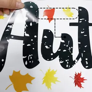 Detail showing adhesive maple leaf decals with polka dot letters and easy-to-peel feature