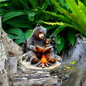 Outdoor garden stake featuring black bear reading by campfire in realistic forest scene