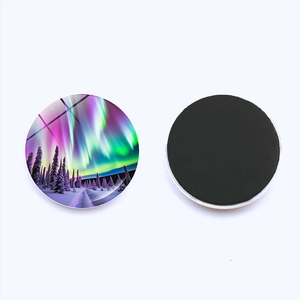 Front and back view of a round crystal glass aurora fridge magnet with magnetic backing