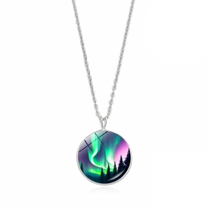 Macro detail of aurora borealis glass pendant with silver chain and forest silhouette