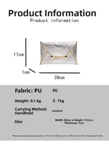 Detail of silver envelope clutch bag with crocodile texture and gold metal buckle trim