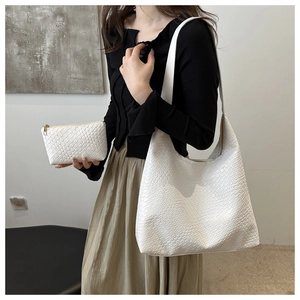 White woven tote bag set with matching zipper pouch and detailed leather texture detail
