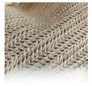 Macro shot of high-density woven straw fabric detail in beige for women's bucket bag