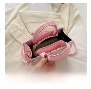 Pink quilted tote bag interior detail showing spacious compartment and small zipper pouch