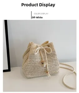Detail of beige straw bucket bag featuring drawstring closure and woven herringbone texture