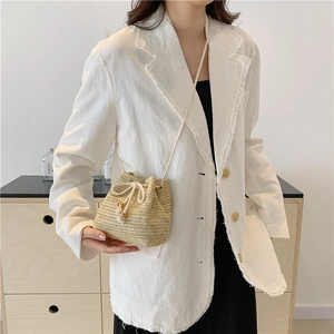 Chic woven drawstring bucket bag in natural beige with pleated texture for women