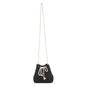 Mini black straw bucket bag with drawstring closure and cream-colored shoulder strap