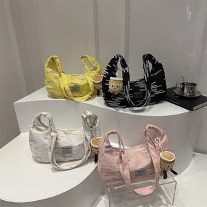 Chic quilted crescent bags in four colors with rainbow embroidery and coffee plush charms