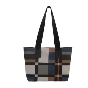 Minimalist patchwork tote bag with stylish plaid patterns and wide black shoulder straps