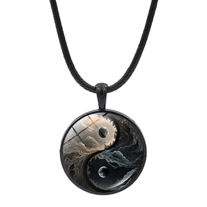 Detail of Yin Yang glass pendant necklace featuring moon and starry sky motifs