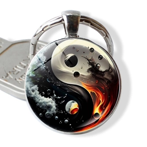 Yin Yang Tai Chi keychain with fire and water design on a round metal pendant