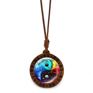 Vintage wood Yin Yang pendant necklace with colorful nebula pattern and wax rope