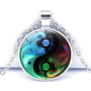 Detail of Yin Yang art glass pendant with colorful fluid patterns on silver alloy chain