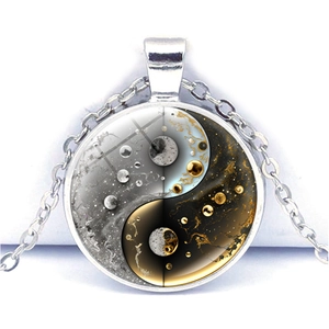 Macro view of yin yang necklace featuring a creative cosmic moon and starry sky design
