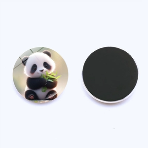 Close-up of circular fridge magnet showing cute panda with bamboo and black magnetic back