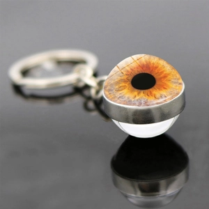 Double-sided crystal glass ball keychain with realistic brown iris eye and silver ring