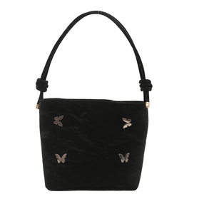 Sac seau noir tendance avec papillons argentés et bandoulière à nœuds élégante
