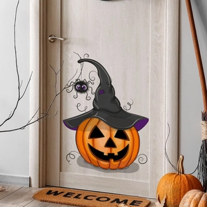 Close-up of Halloween pumpkin wall sticker with a wizard hat and spider on a wooden door