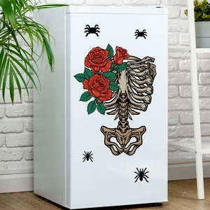 Skull ribcage with red roses wall sticker and black spider decals on a fridge