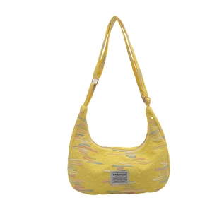 Quilted yellow hobo bag with colorful rainbow embroidery and wide shoulder strap