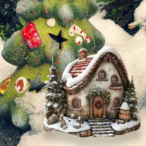 Macro shot of detailed PVC Christmas village house ornament with snow textures
