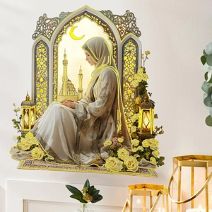 Creative wall sticker of a Muslim woman praying by a window with Islamic architecture