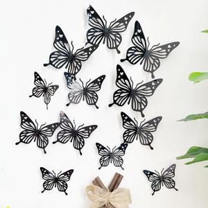 Set van 12 zwarte 3D vlinder muurstickers met hartvormige details voor huisdecoratie