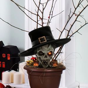 Detailed view of Halloween skull garden stake featuring glowing eye and black top hat décor