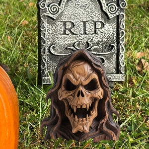 Halloween reaper skull garden stake with wood grain texture and spooky fangs decor