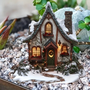 Christmas miniature house decor with warm LED lights and faux snow for garden