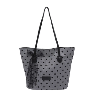 Grey polka dot tote bag with black bow patterns and lace ribbon on white background