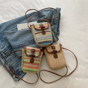 Handwoven mini crossbody phone bag with horn buckle and leather straps in summer style