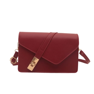 French vintage style red crossbody bag with V-shaped flap and gold rotating clasp