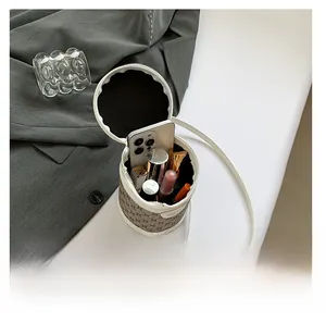 Interior capacity detail of the vintage monogram cylinder bag showing daily essentials
