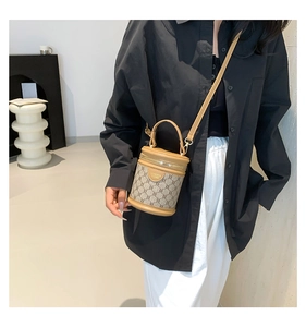 Detail of the vintage bucket bag with geometric prints and adjustable leather strap