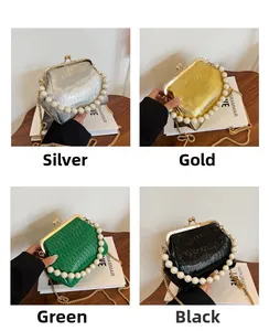 Detail of pleated evening bags in four colors with pearl handles and metal chains