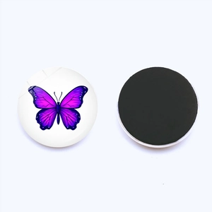 Detailed view of 25mm round crystal glass fridge magnet featuring purple butterfly pattern