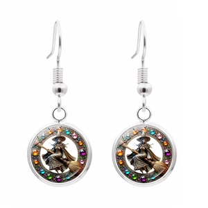Detail of silver witch broom earrings with colorful gemstones and glass cabochon pendants