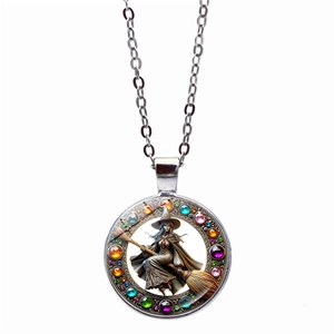 Close-up of witch on broomstick time gem pendant with multi-colored faux gemstones