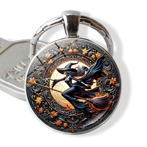 Detailed view of Halloween witch pendant with glass dome and silver alloy keychain
