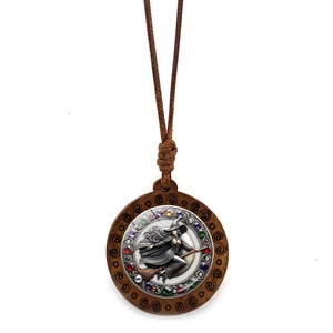 Vintage witch riding broomstick pendant necklace with colorful gems on woven wax rope