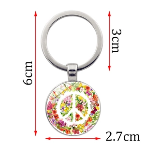 Silver peace sign keychain featuring a colorful floral pendant with 6cm total length
