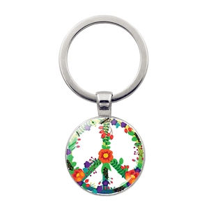 Detailed view of metal keychain with colorful floral peace sign charm and silver ring