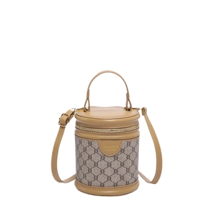 Cylindrical brown monogram bucket bag with top handle and adjustable shoulder strap
