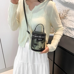 Mini black cylinder bucket bag with green butterfly embroidery and adjustable strap